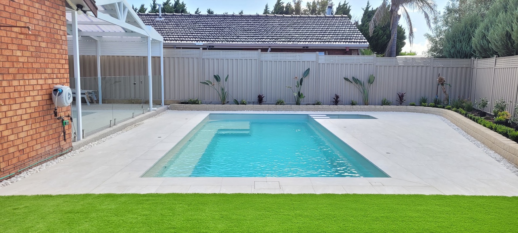 Wide white limestone pool surround