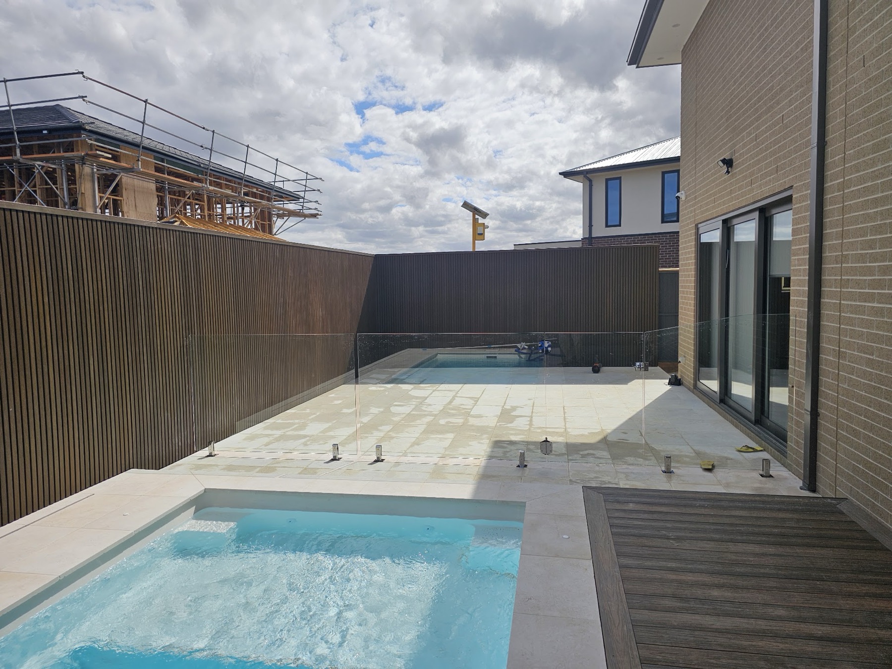 Limestone surround around a pool and spa