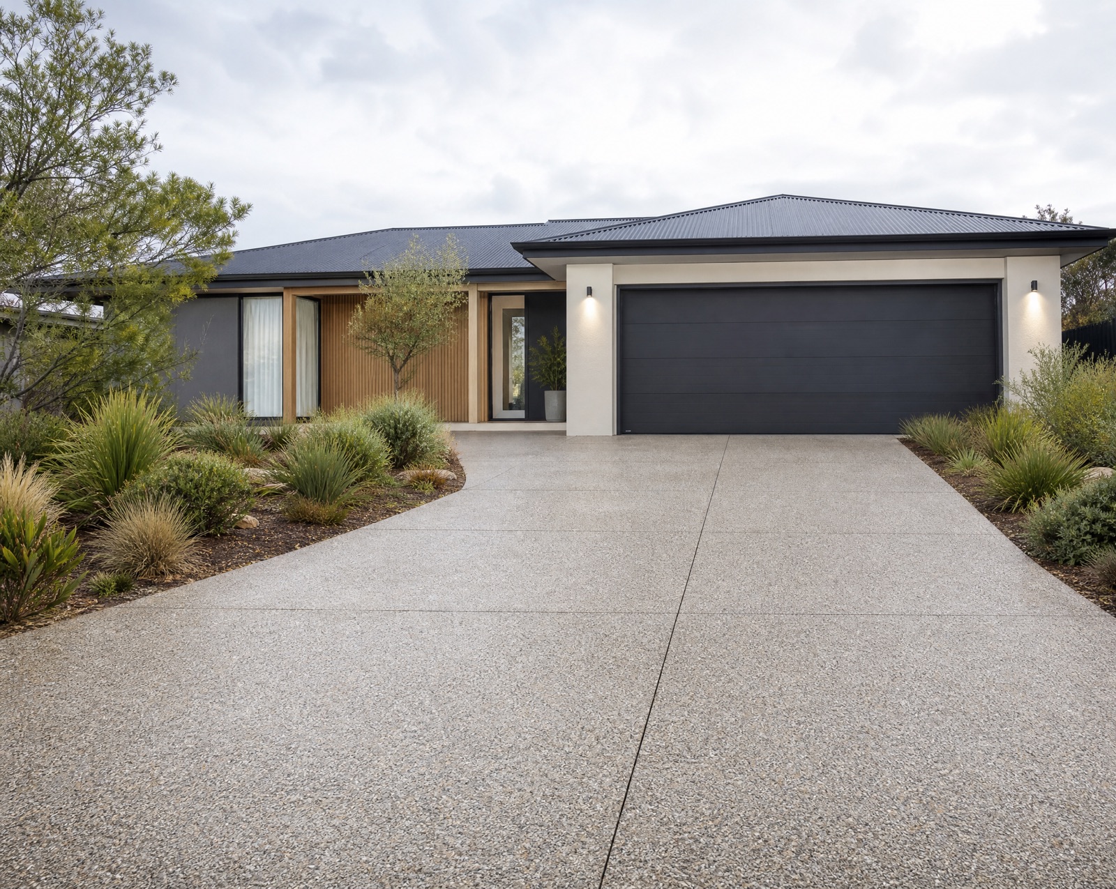 Finished exposed-aggregate concrete driveway at a modern Melbourne home